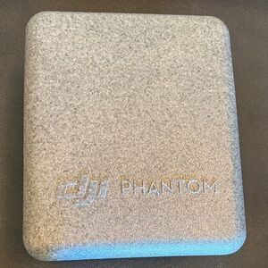 DJI Phantom 4 Drone with Silver Protective Case in used condition for parts